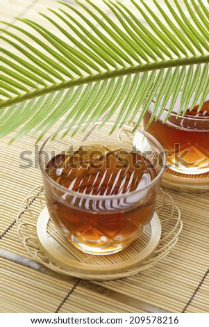 The Barley Tea Made Up Of Glass And The Sprout Of Cycad