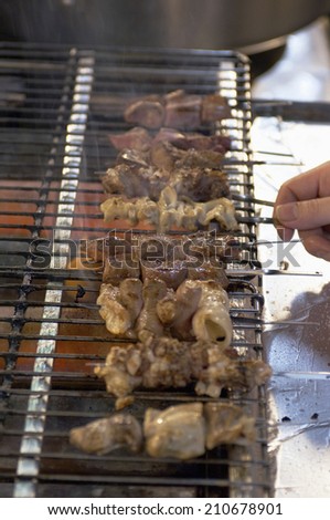 Grilled Ton And Motu Being Baked In Charcoal Fire