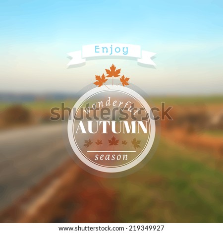 Poster with autumn landscape. Motto, slogan for autumn season. Maple leaves on a autumn road background. Emblem for autumn poster. Circle emblem of wonderful autumn season on a photo background.