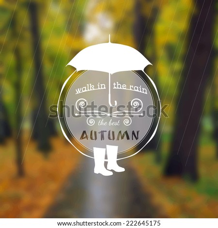 Poster with autumn landscape. Motto, slogan for autumn season. Umbrella and rubber boots on a autumn park background. Walk under the autumn rain. Circle emblem of  autumn season on a photo background.