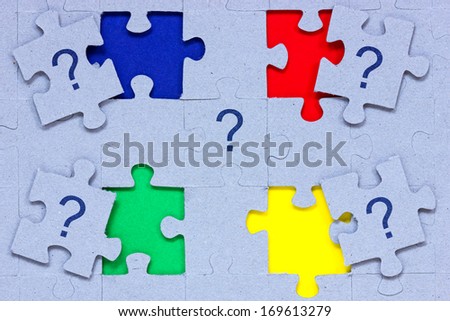 Problem solving concept. Puzzle  with question marks on it.