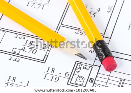 Two yellow pencils on the building plan