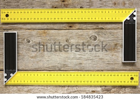 Right angle square tools on the wooden background