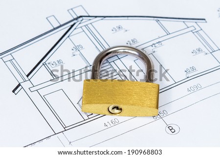 Concept of housing. Architectural house drawings with yellow padlock