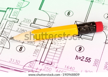 Engineering and architecture drawings with yellow pencil