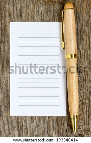 Wooden pen and note paper for your own text