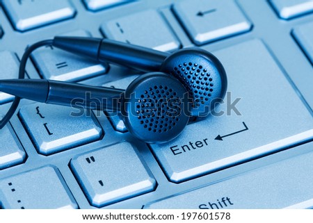 Headphones and computer keyboard, concept of digital music