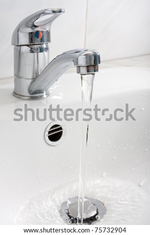 pure water running down from the faucet