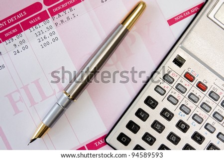 ink pen,calculator  and payroll summary details