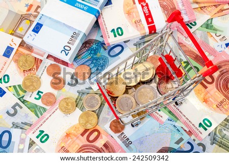 Euro currency and shopping cart. Concept for purchasing power, shopping, money printing and inflation