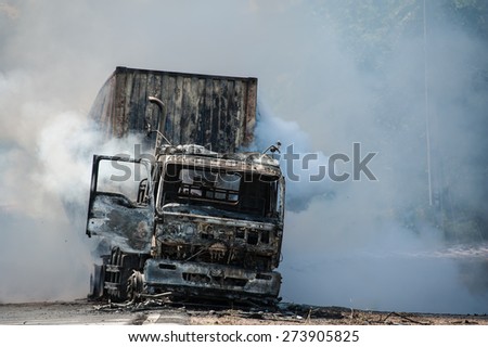 SURATTHANI THAILAND- AUG 17: Police firefighter rescuers helped extinguish a burning tractor trailer trucks horn pure alcohol on Aug 17,2014 in suratthani province,thailand