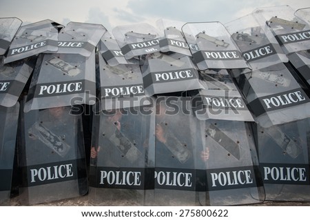 SURATTHANI THAILAND- Apr 8: Polices practice riot controlling using a shield and a truncheon at police training academy . Apr 8,2014 in suratthani province,Thailand