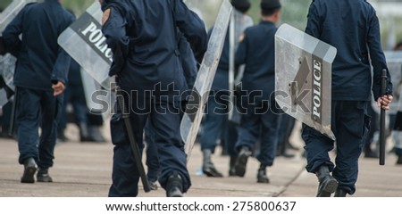 SURATTHANI THAILAND- Apr 8: Polices practice riot controlling using a shield and a truncheon at police training academy . Apr 8,2014 in suratthani province,Thailand