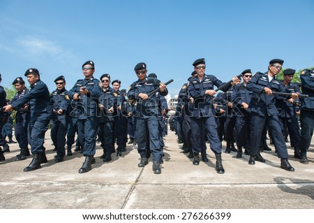 SURATTHANI THAILAND- Apr 28: Polices practice riot controlling using a shield and a truncheon at police training academy . Apr 28,2014 in suratthani province,Thailand