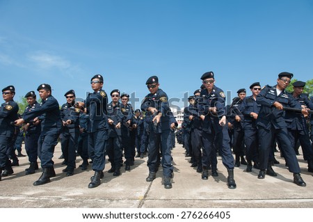 SURATTHANI THAILAND- Apr 28: Polices practice riot controlling using a shield and a truncheon at police training academy . Apr 28,2014 in suratthani province,Thailand