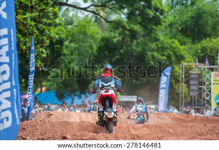 SURAT THANI THAILAND- Jul 20: The motorcross competition for charity and free fee to see .Among crowed of people to cheer up at BanhuoySork School on  Jul 20, 2014 in surat thani province,Thailand
