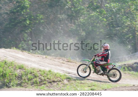 SURAT THANI THAILAND- Feb 9: The motorcross competition for charity and free fee to see .Among crowed of people to cheer up at changsaicity on Feb 9, 2014 in Surat thani province,Thailand