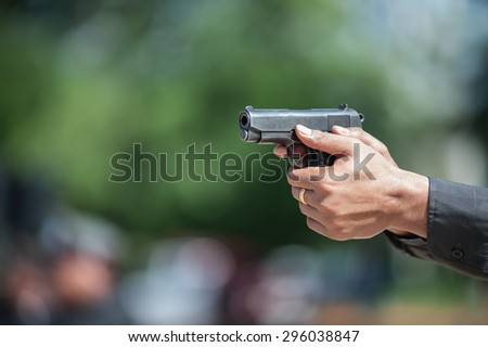 Riot police practice of using armed tactical pistol.