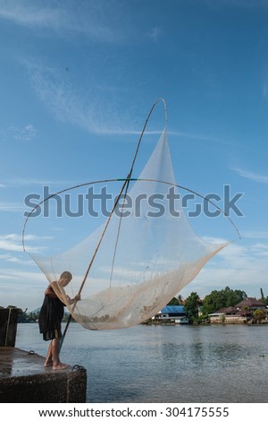 SURATTHANI THAILAND- Jul 26: Fishermen can fish along the banks all year long by using fishing gear at Punpin. July 26,2015 in surat thani province,Thailand