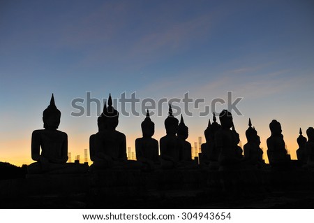 Buddha silhouette at dusk sunset.