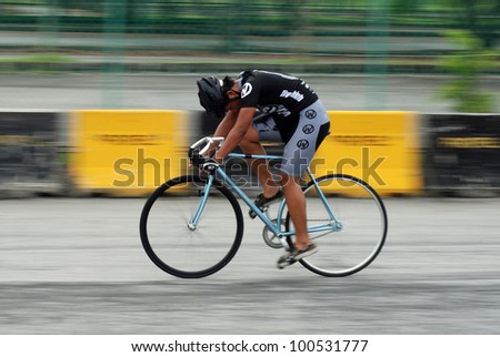 KUALA LUMPUR - APRIL 14: Zaim Rosli of Wightset Cycling Team ride during 24/7 Bigtime Criterium Race at Kuala Lumpur Speed City on April 14, 2012 in Kuala Lumpur, Malaysia