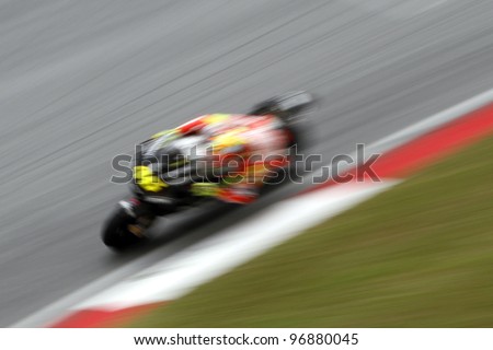 SEPANG, MALAYSIA-FEB 29:Motion blur of Italian Valentino Rossi of Ducati Team at the 2nd MotoGP winter testing on Feb 29, 2012 in Sepang, Malaysia. The 2012 MotoGP season starts on April 8 in Qatar.