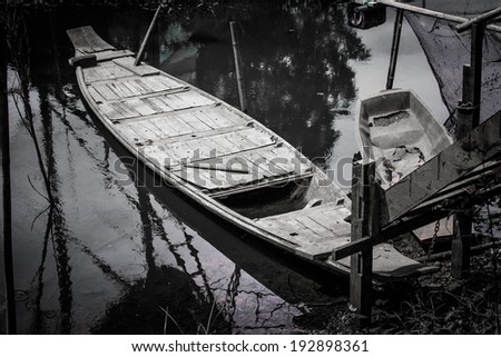 black and white portrait old wooden ship canal that represents the old way of life in Thailand