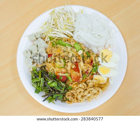 green papaya salad in trays that are popular in Thailand, a Thailand\'s Northeast.