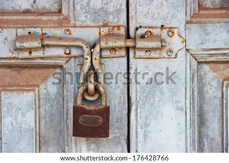 Rusty lock on old door close up