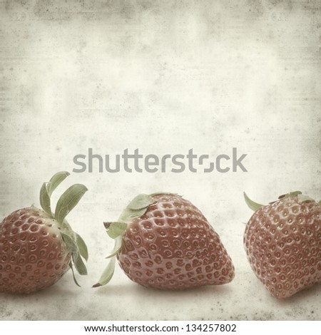 textured old paper background with strawberries