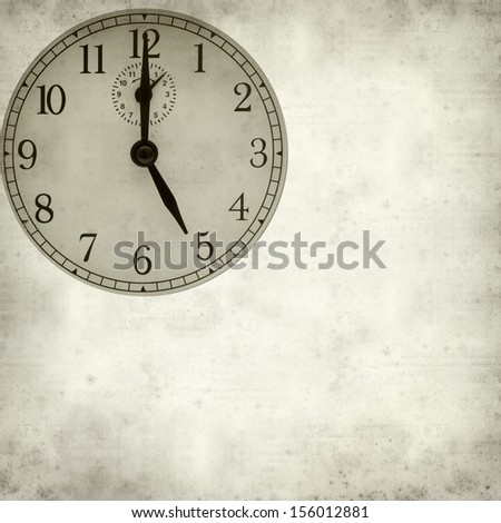 textured old paper background with old fashioned alarm clock