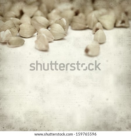textured old paper background  with scattered buckwheat