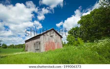 Finnish summer landscape with old barn