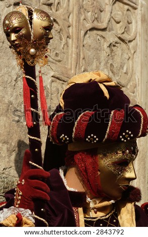 Venice carnival - masked man with long staff