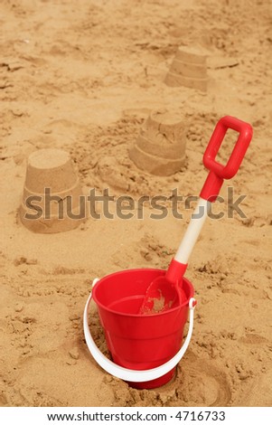 traditional seaside past time - playing with sand