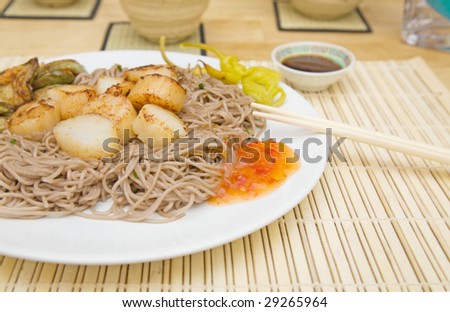 fried scallops on stir-fried buckwheat noodles