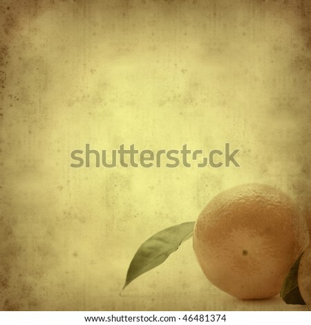 textured old paper background with mandarin fruit