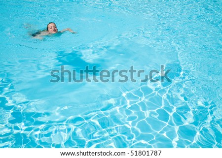 beautiful swimming pool background - open air swimming pool, smiling little by swimming in one corner