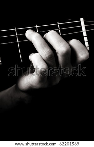Major chord (C) on classical guitar; toned monochrome image;