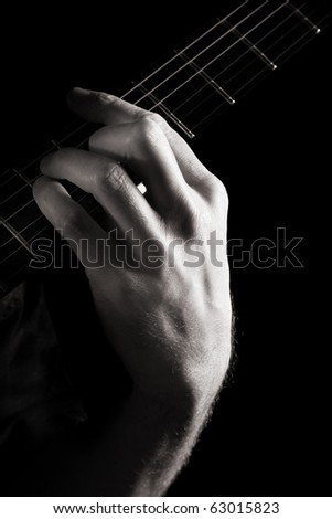 Major chord (A) on electric guitar; toned monochrome image