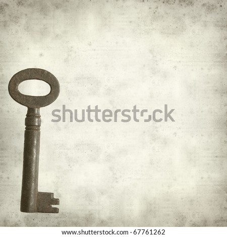 textured old paper background with old rusty antique metal key