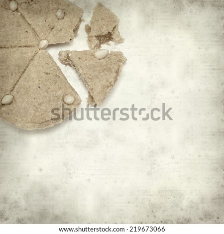 textured old paper background with soft marzipan cake