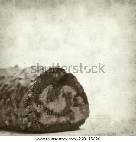 textured old paper background with chocolate roll cake