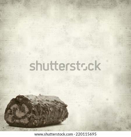 textured old paper background with chocolate roll cake