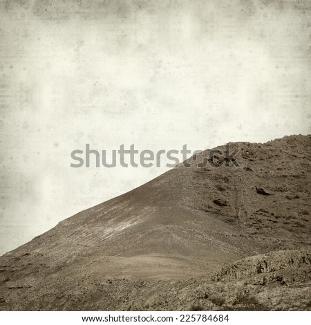 textured old paper background with mountains of Fuerteventura