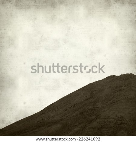 textured old paper background with Tindaya, sacred mountain of Fuerteventura