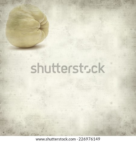 textured old paper background with yellow ripe quince fruit