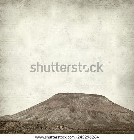 textured old paper background with Montana Roja, red Mountain, of Fuerteventura