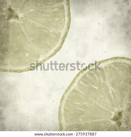 textured old paper background with cut lime fruit