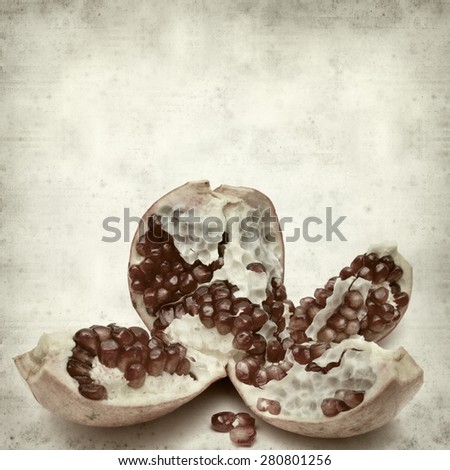 textured old paper background with pomegranate seeds